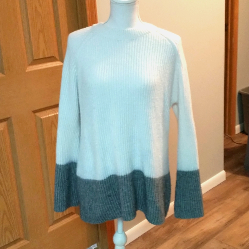 A winter sweater with wide sleeves.